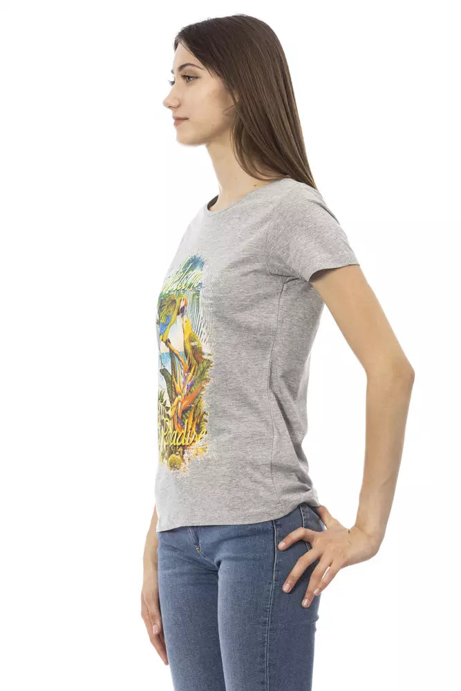 Woman wearing gray t-shirt with graphic design on front