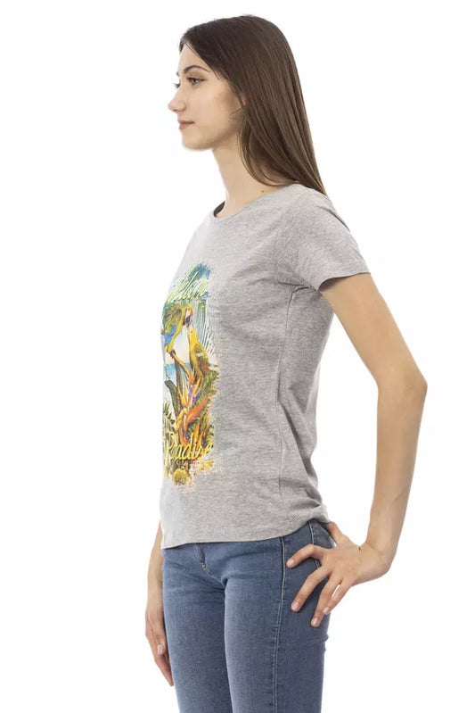 Woman wearing gray t-shirt with graphic design on front
