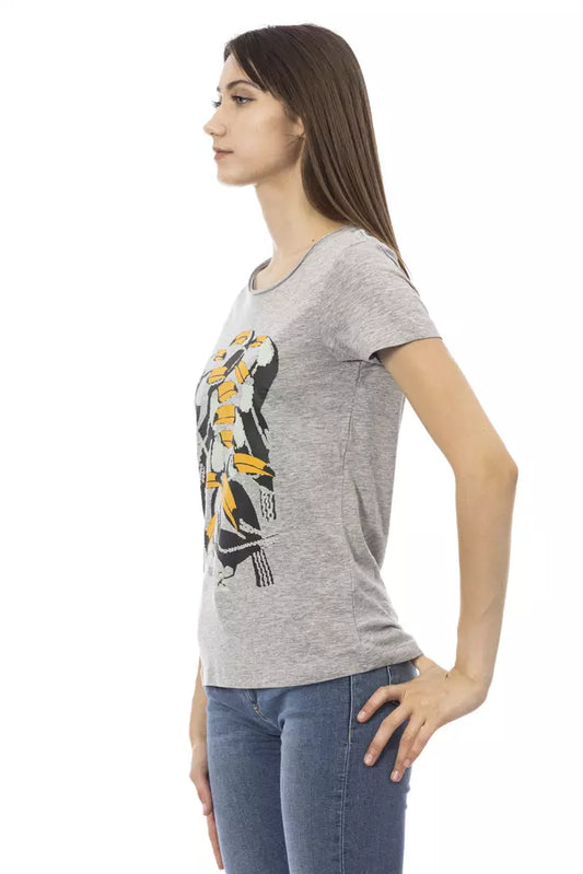Woman wearing gray t-shirt with graphic design on front