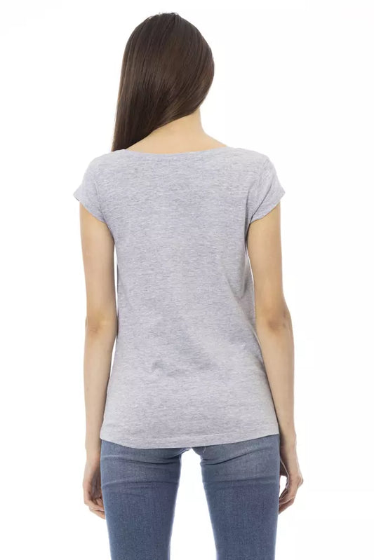 Woman wearing gray short sleeve shirt