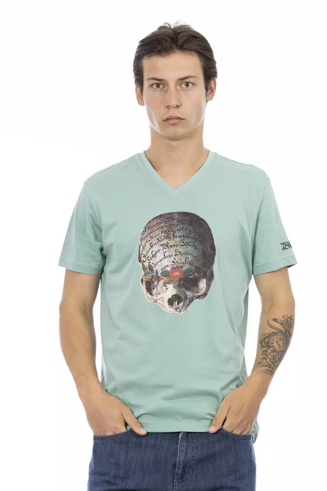 Man wearing a green t-shirt with a skull design on it