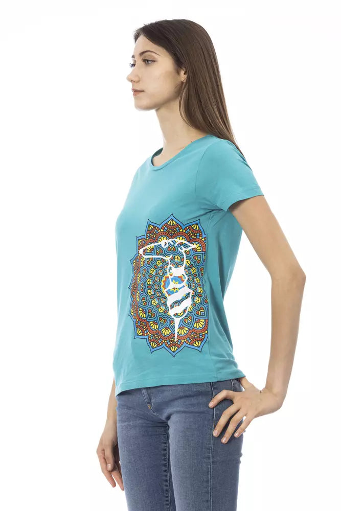 Woman wearing blue shirt with colorful design on front