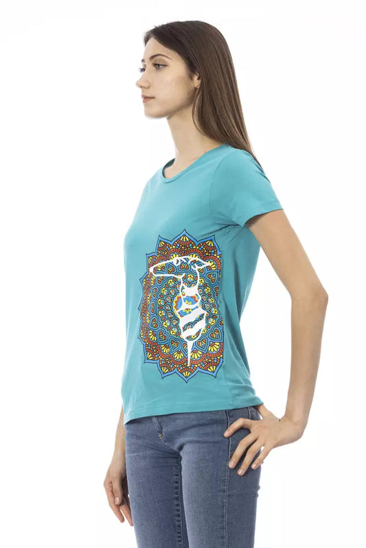 Woman wearing blue shirt with colorful design on front