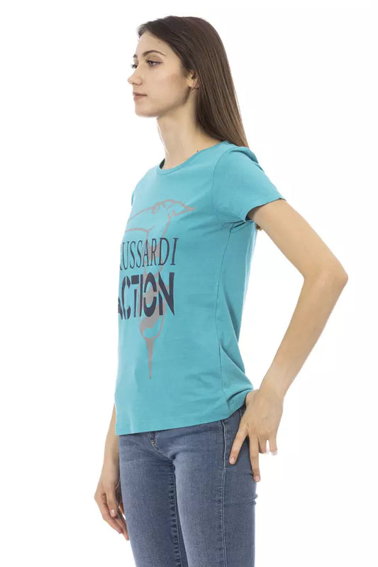 Woman wearing blue shirt with graphic design on front