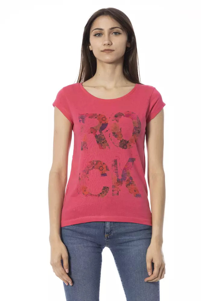 Woman wearing pink shirt with floral pattern