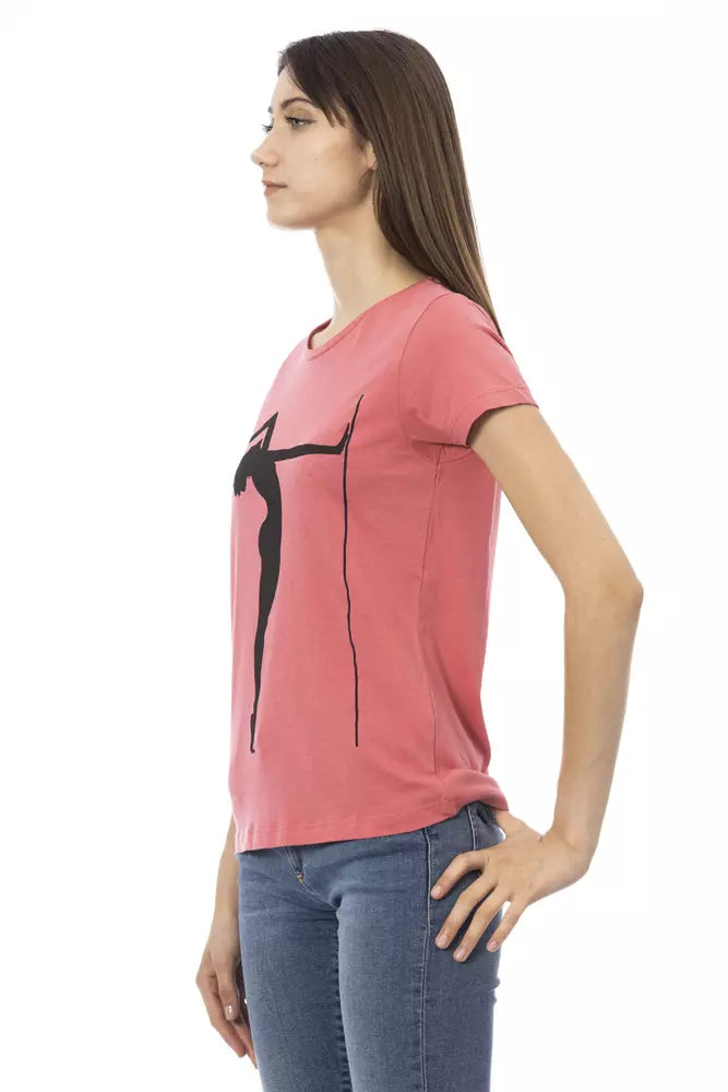 Woman wearing pink shirt with black graphic design