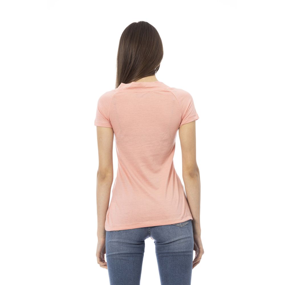 Pink women's t-shirt with short sleeves, worn by a model against a white background
