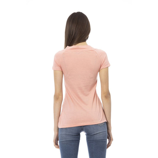 Pink women's t-shirt with short sleeves, worn by a model against a white background