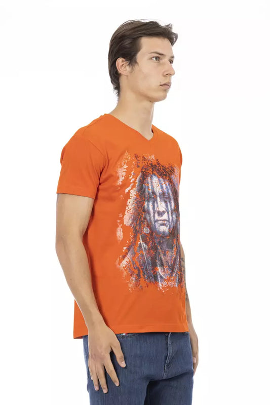 Man wearing orange t-shirt with graphic design on front