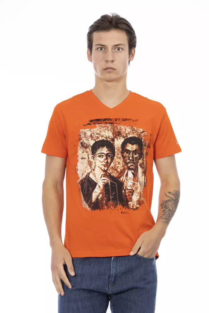 Man wearing orange t-shirt with graphic design on front