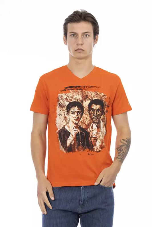 Man wearing orange t-shirt with graphic design on front