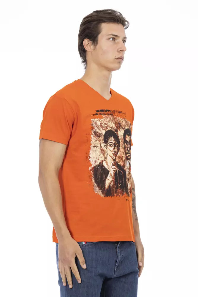 Man wearing orange t-shirt with graphic print on front