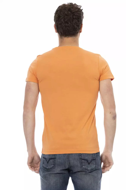 Man wearing orange t-shirt and blue jeans