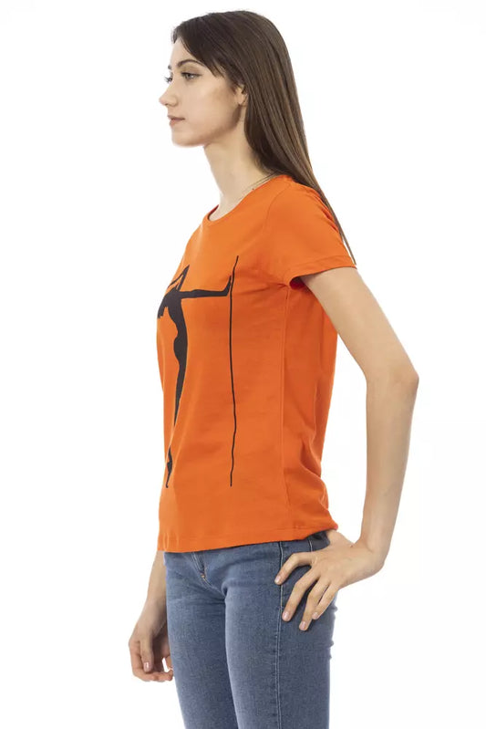 A woman wearing an orange cotton t-shirt with black graphic design on the front