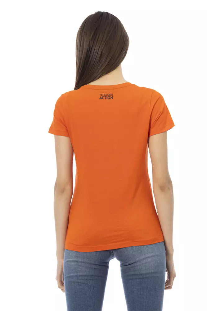 A woman wearing an orange cotton t-shirt with a black logo on the back