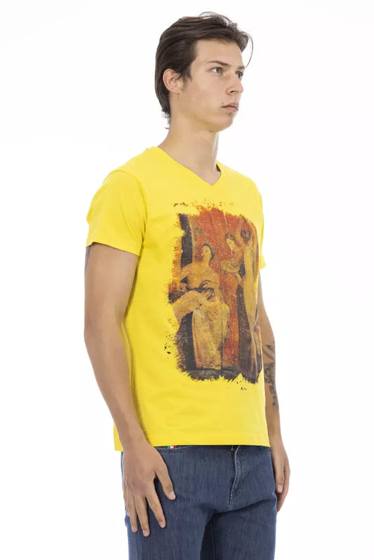 Man wearing yellow t-shirt with abstract design on front