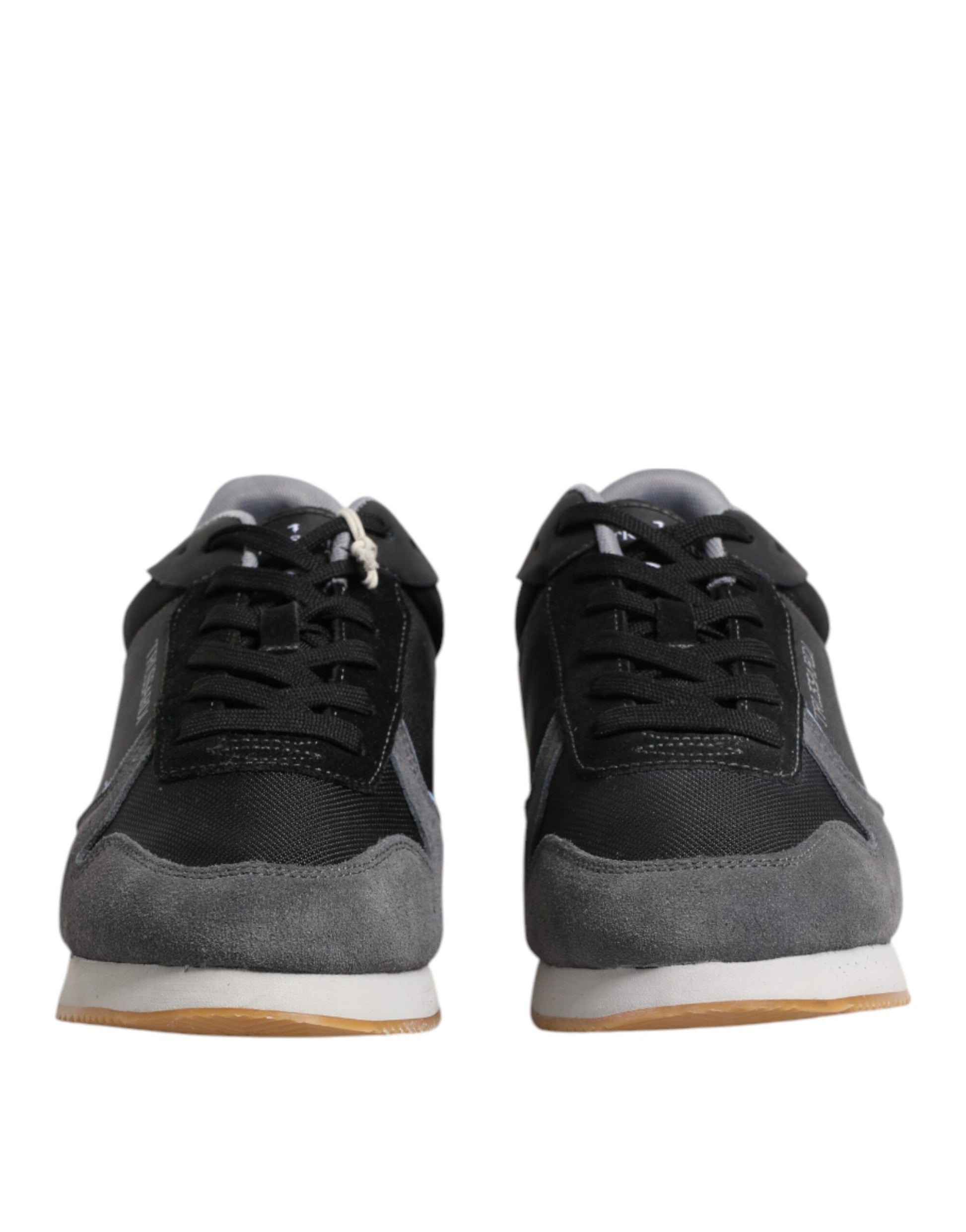 Pair of black sneakers with white laces