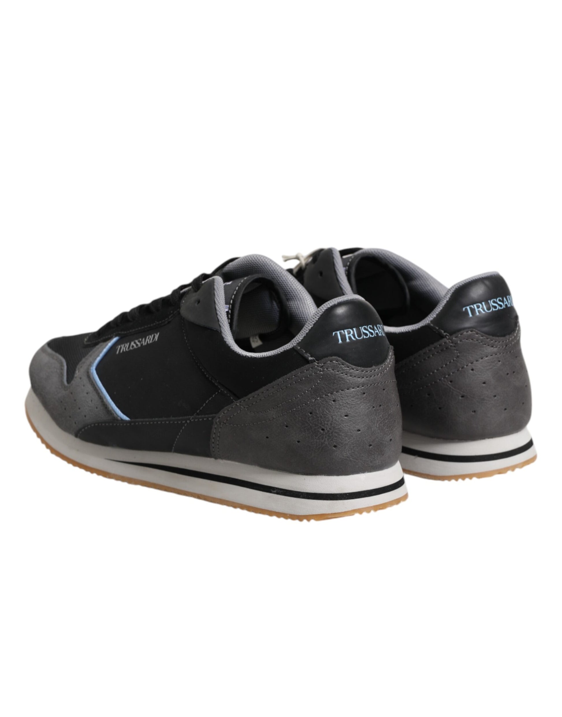 Pair of black sneakers with white sole