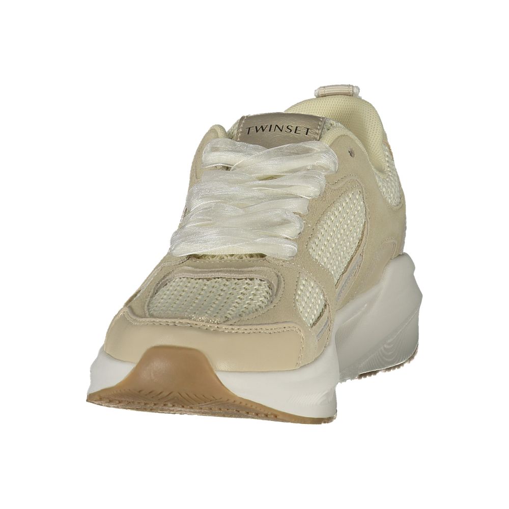 Tan women's sneaker with white laces, mesh panels, and a rubber sole