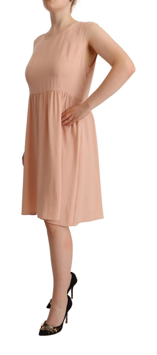A sleeveless knee length dress in beige polyester