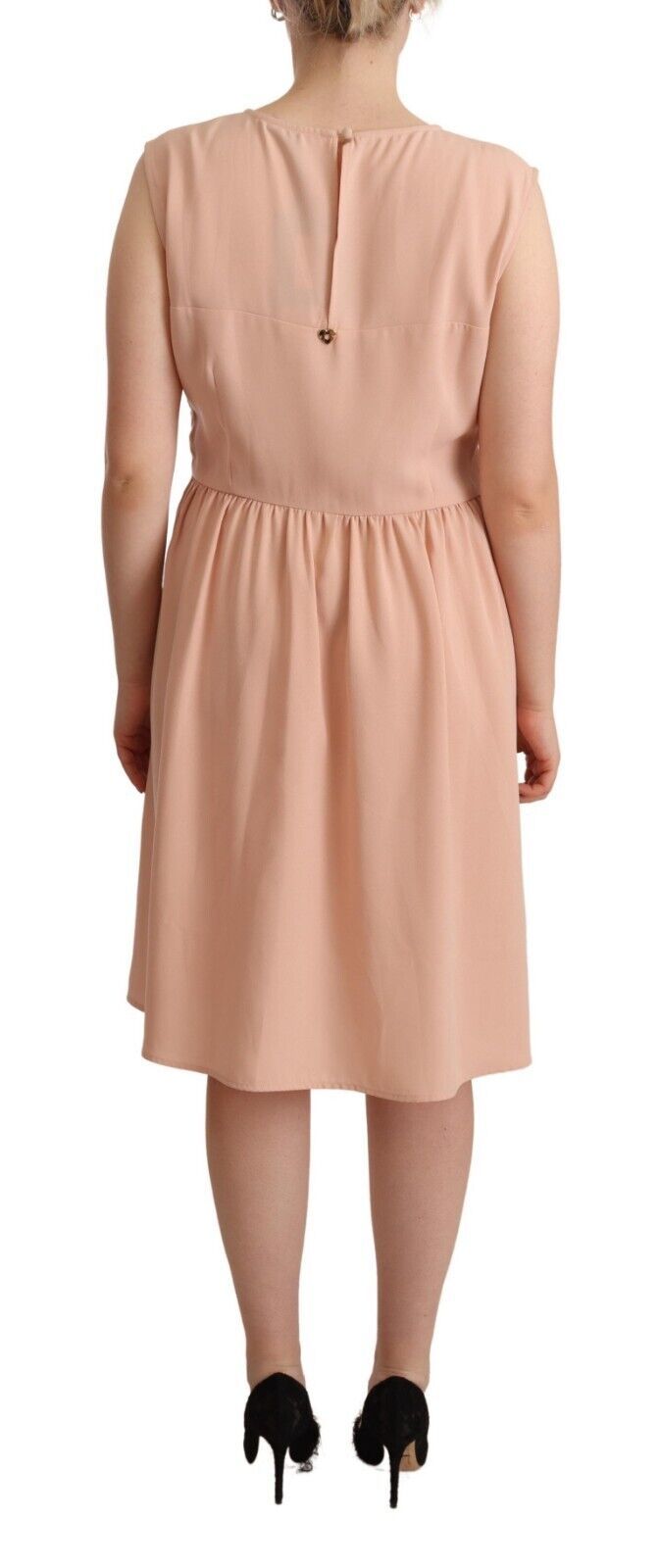 A beige polyester sleeveless shift knee length dress