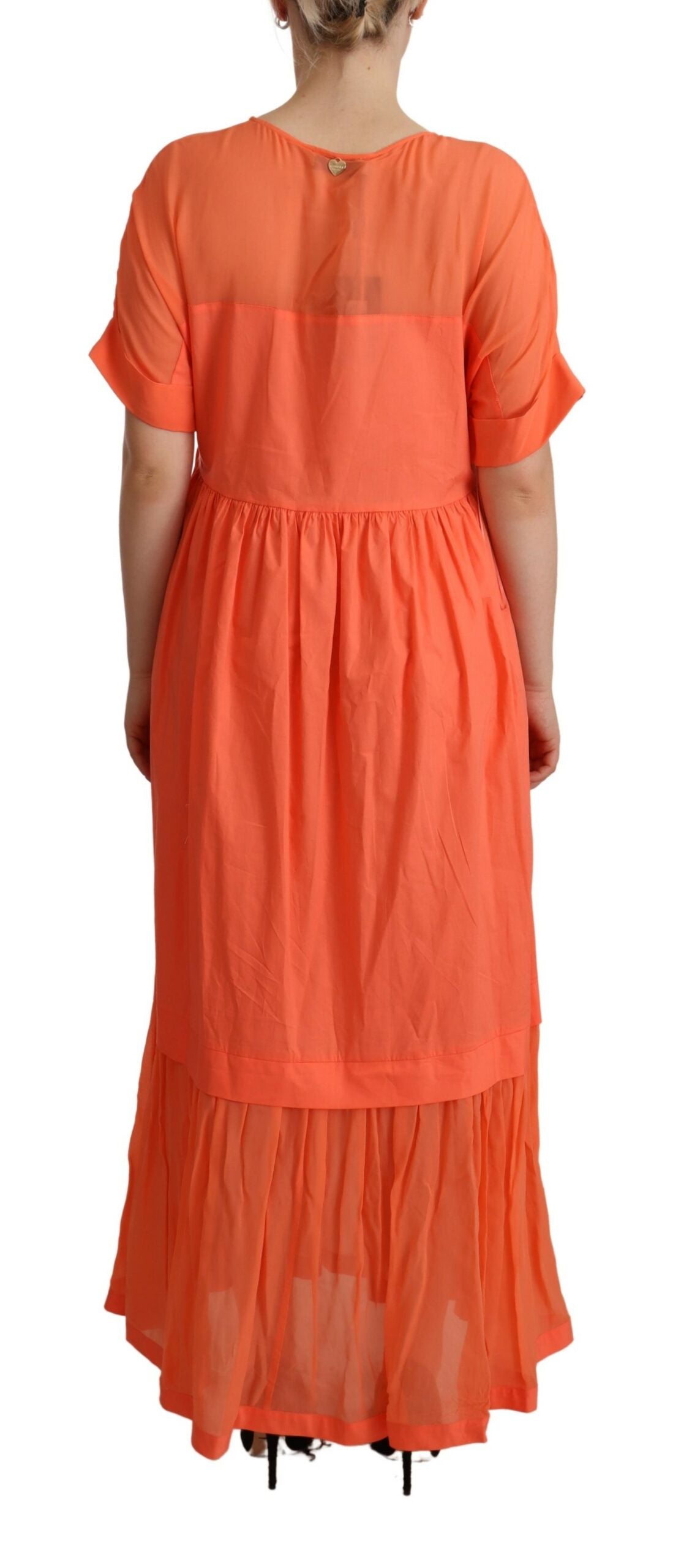 Long orange dress with ruffles on sleeves