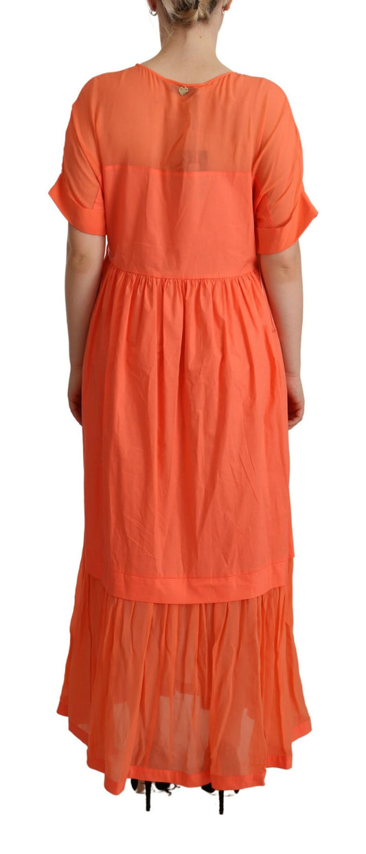 Long orange dress with ruffles on sleeves