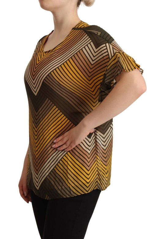 Woman wearing a yellow and brown patterned top
