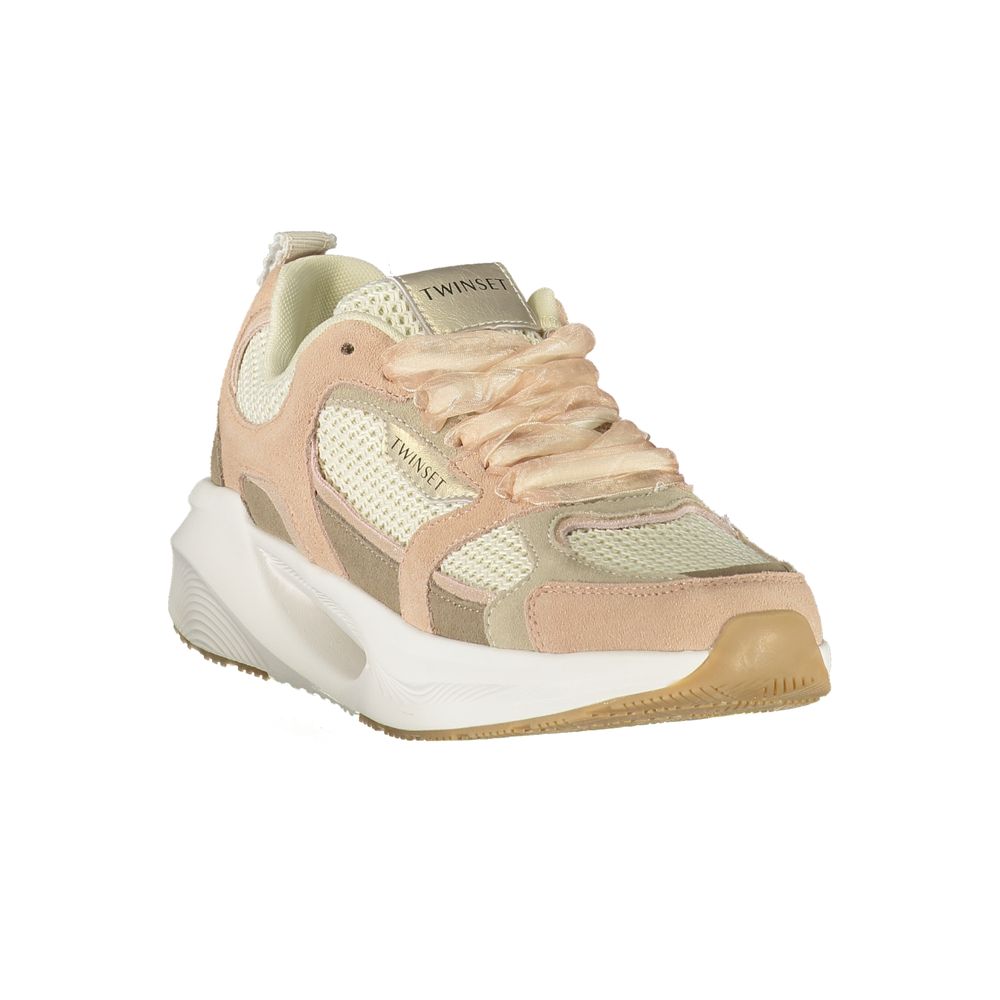A pink fabric women's sneaker with a white sole, laces, and logo on the side
