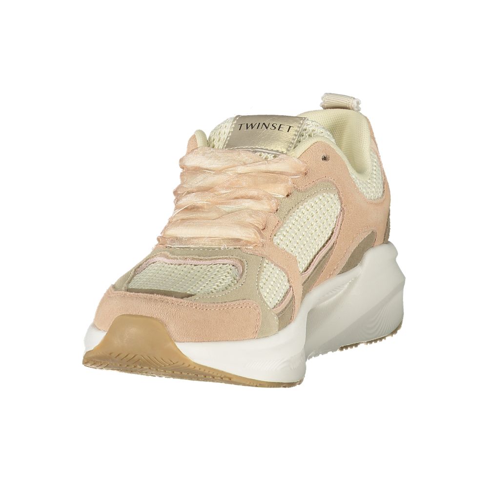 Pink fabric women's sneaker with white sole, laces, and logo on tongue