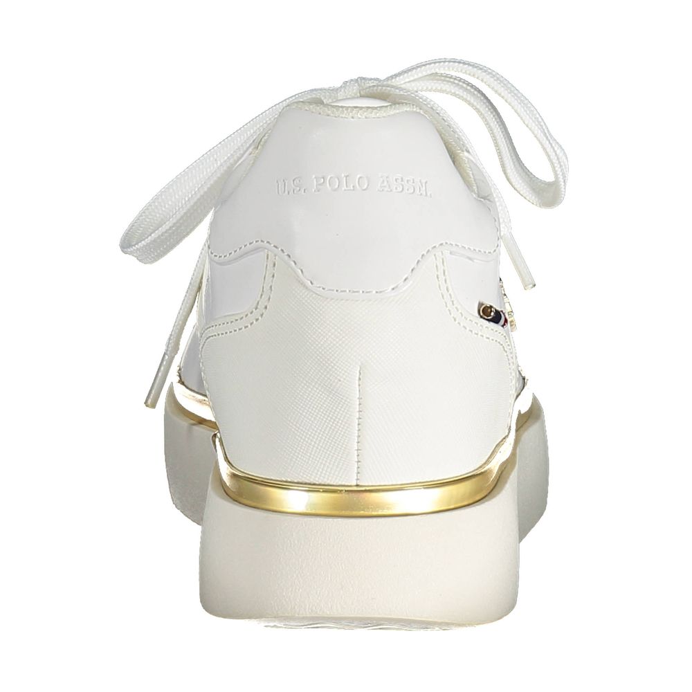White women's sneaker with gold accents, laces and logo
