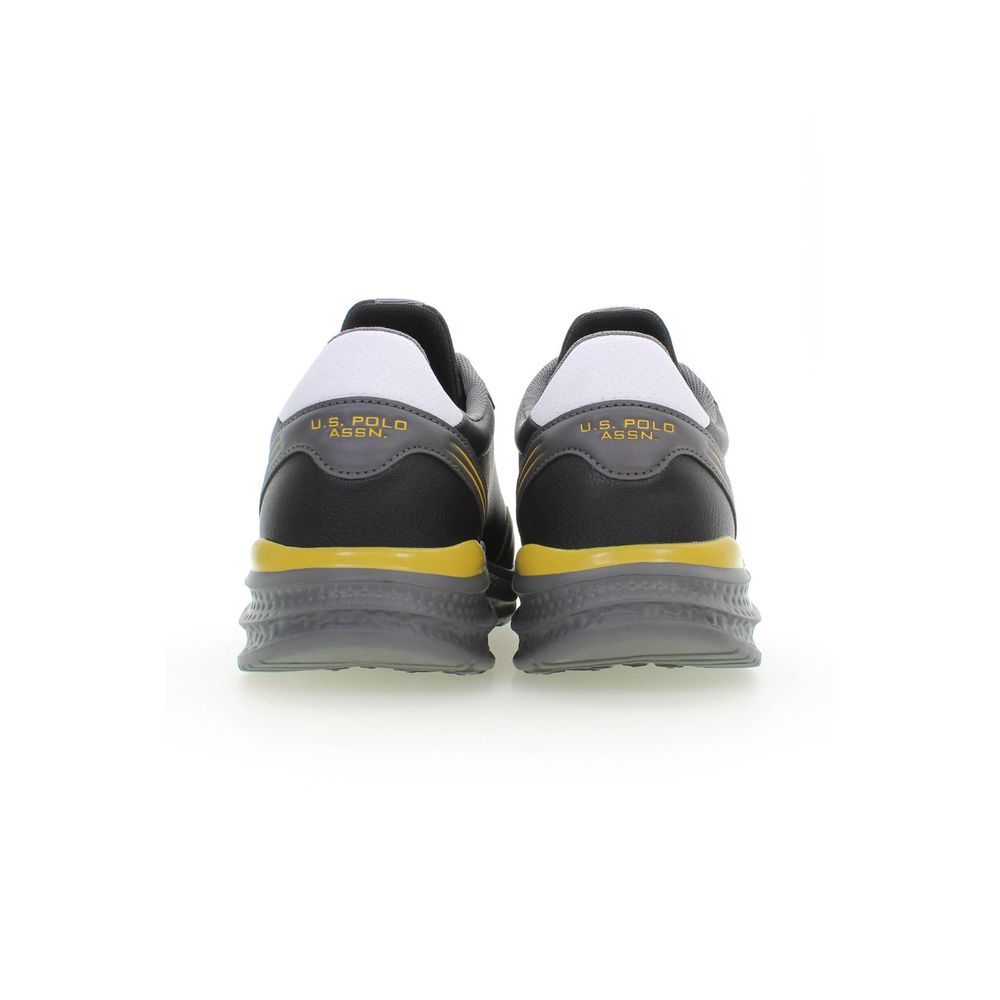 Pair of black and yellow men's sneakers with white laces, featuring the US Polo Assn logo on side