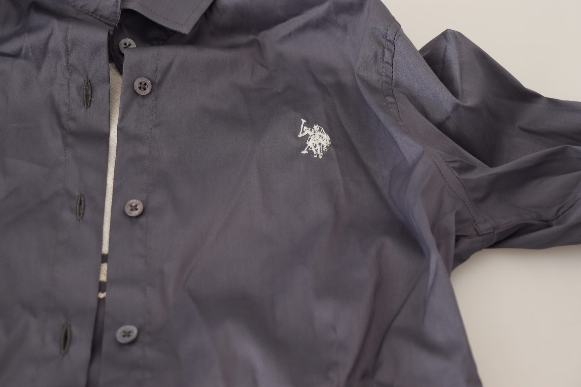 Dark blue rain jacket with zippered front closure