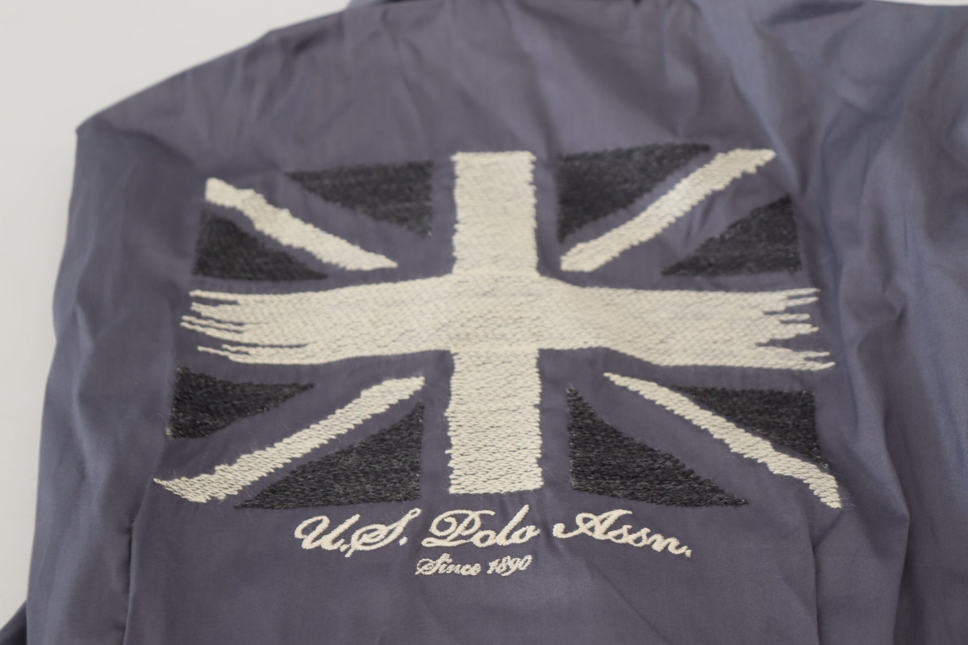 British flag jacket with embroidered logo on front