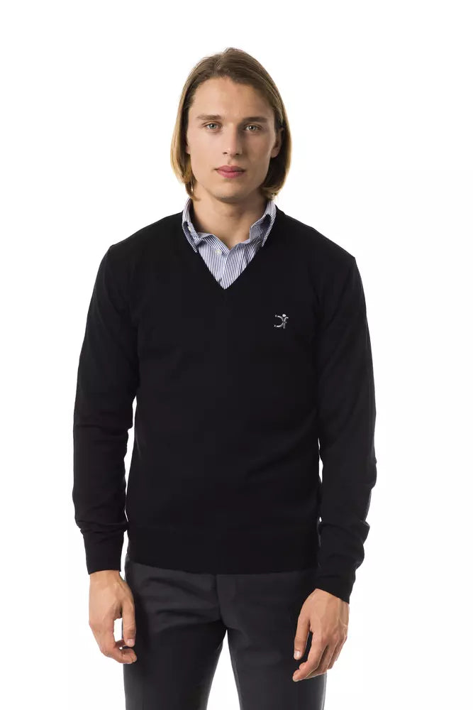 Man wearing black sweater with white collar