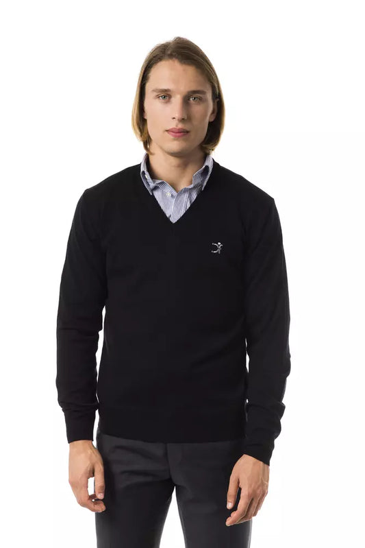 Man wearing black sweater with white collar