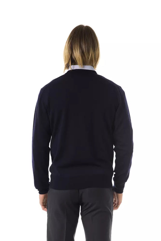 Dark blue sweater worn by a person standing against white background