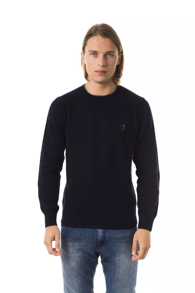 Man wearing dark blue long sleeve sweater