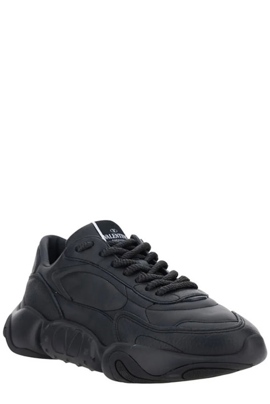 Black sneaker with white sole and laces