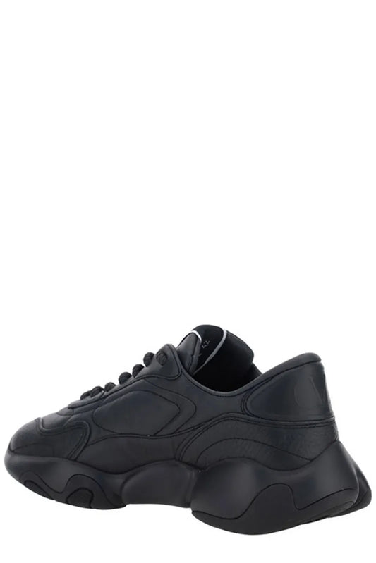 Black sneaker with white sole and laces