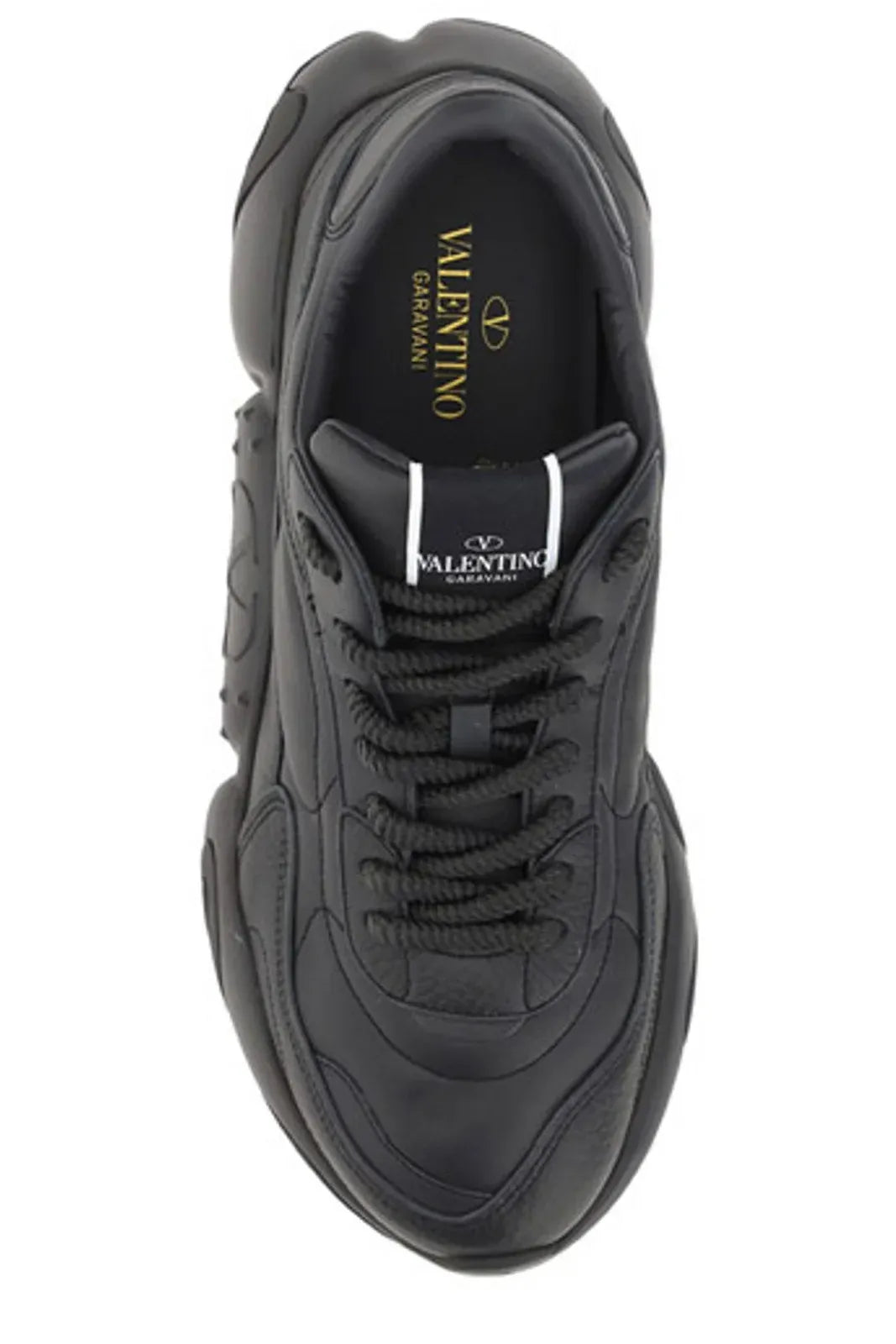 Black sneaker with white logo on side and tongue