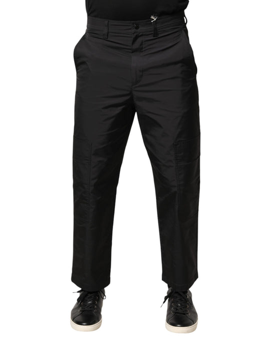 A pair of black men's trousers with a mid-waist design and tapered legs