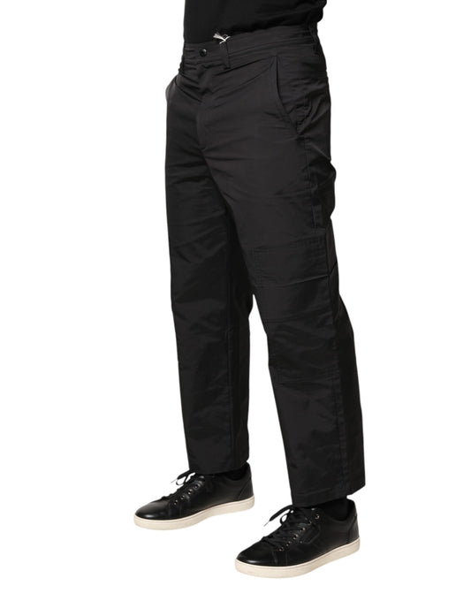 A pair of black men's trousers with a mid-waist design and tapered legs