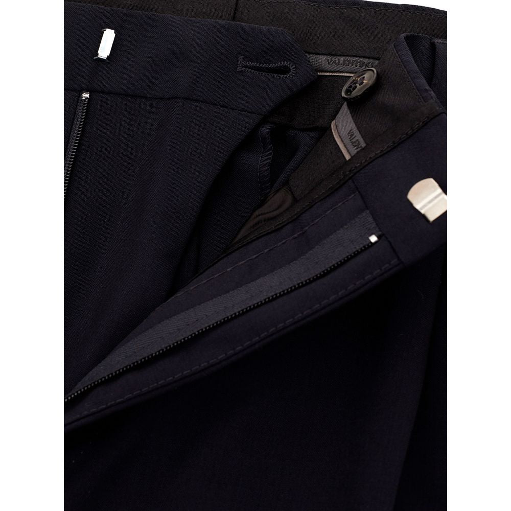 A pair of black wool dress pants with a zippered front closure
