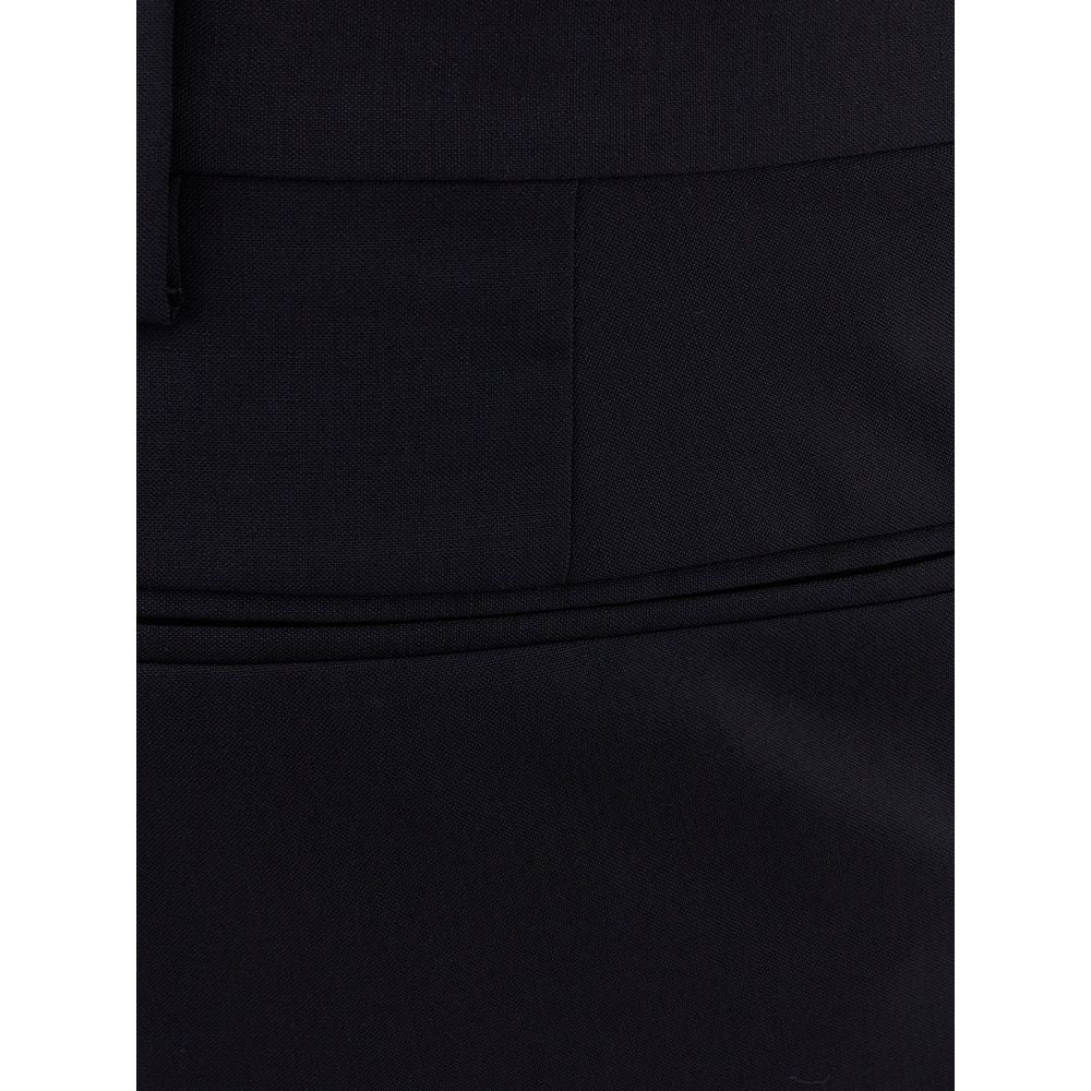 A pair of black wool dress pants with a slim fit