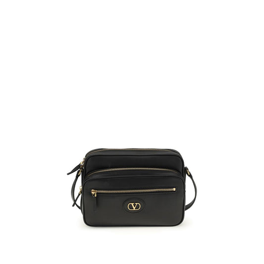 Black leather crossbody bag with gold hardware