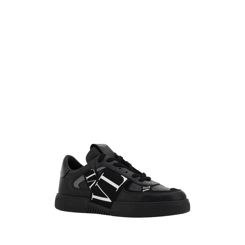 Black sneaker with white laces and logo on side