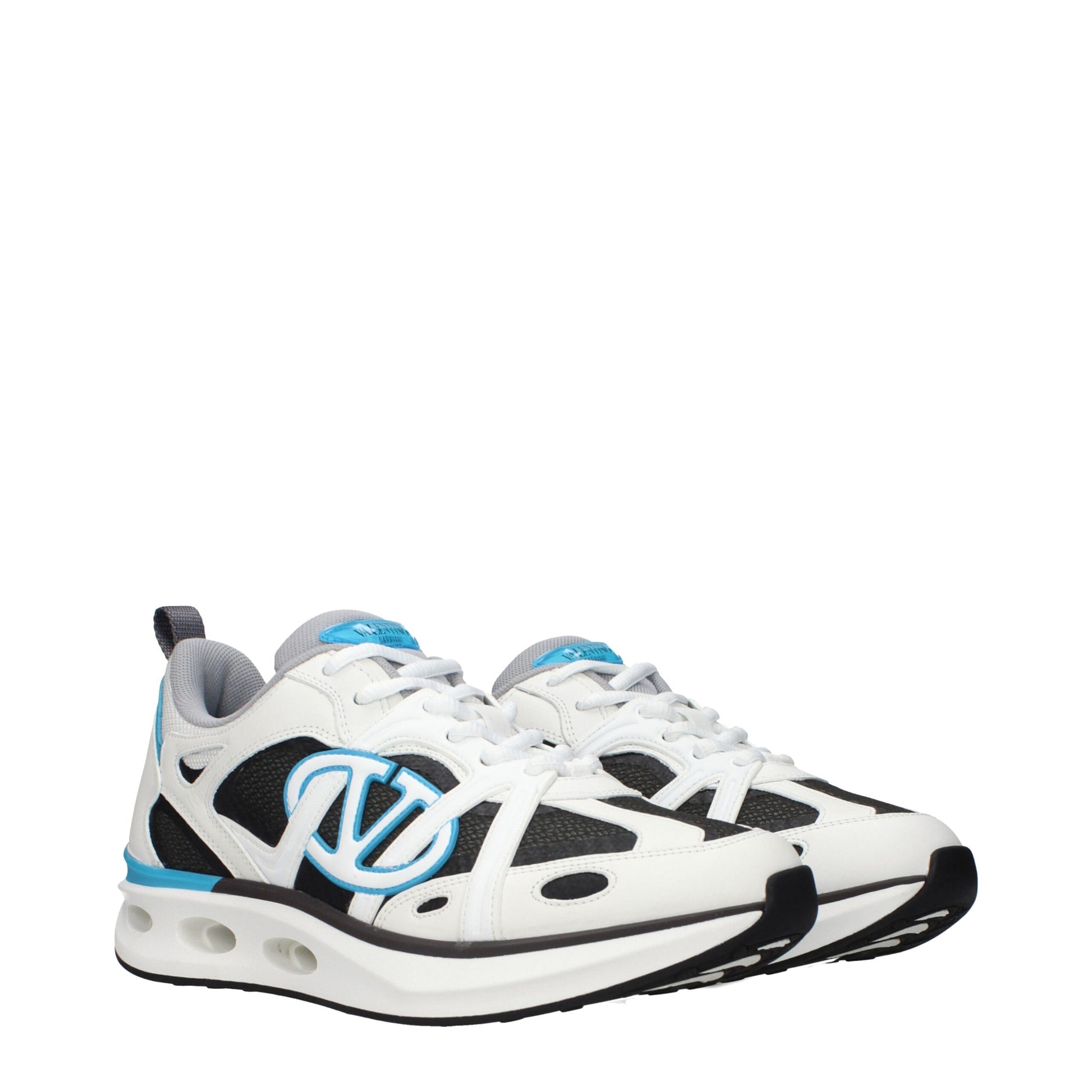 White athletic sneakers with blue accents, featuring a bow design on the side and a logo on the tongue