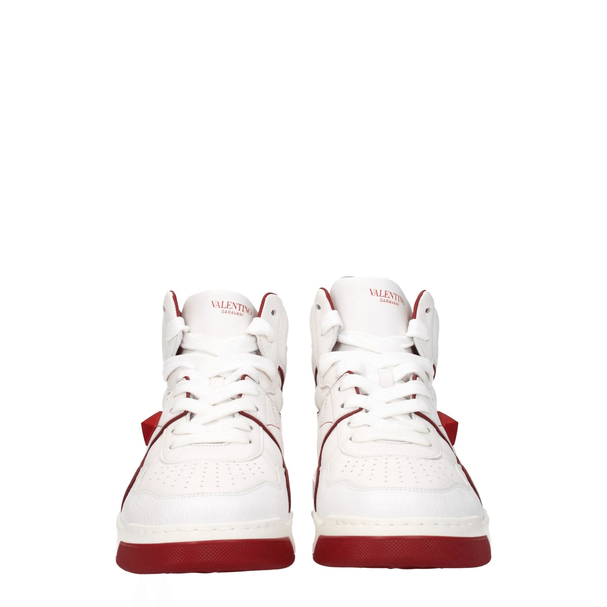 Pair of white leather high top sneakers with red accents, featuring lace-up closure and brand logo on side