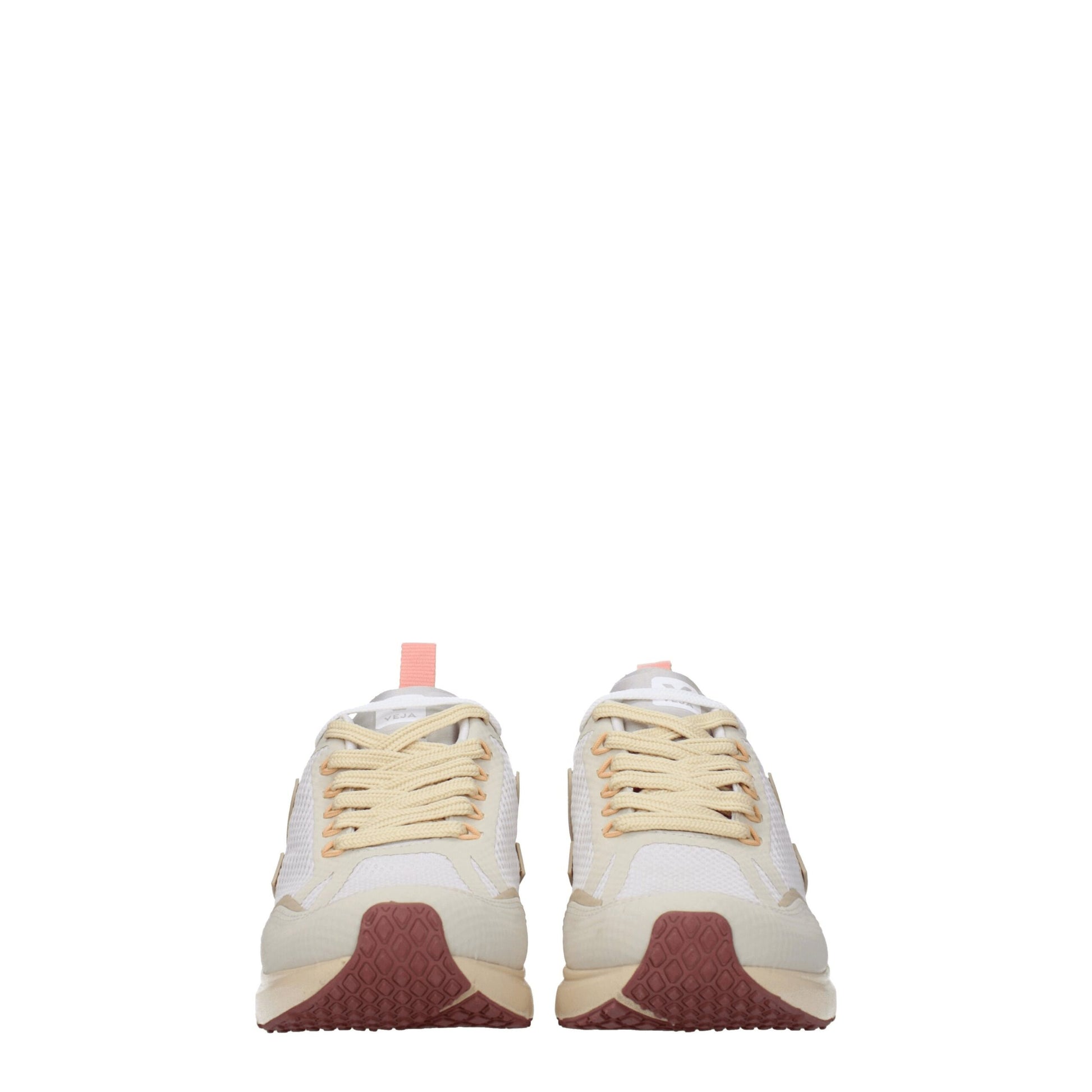 Pair of beige fabric athletic sneakers with yellow laces